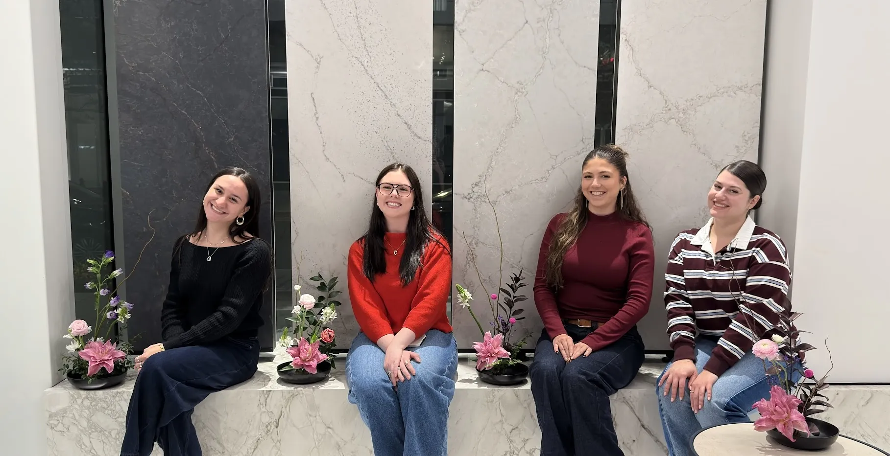 Participants creating Ikebana arrangements together in a workshop setting
