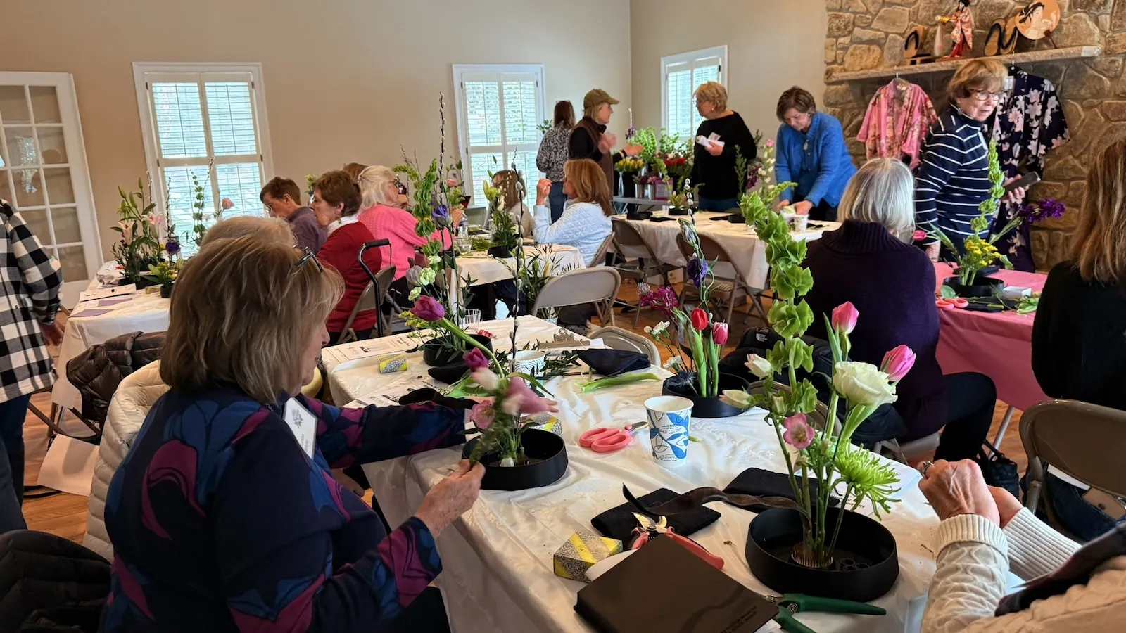 Participants creating their Ikebana arrangements during the Woodlea Garden Club workshop